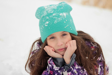  girl with long hair on background of a winter field