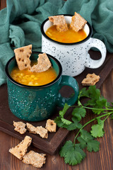 A healthy vegetarian bean soup in bowl on old wooden table