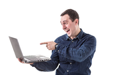 young programmer (man) holding a laptop in hands and talking on skype with friends isolated on white background. Copy space