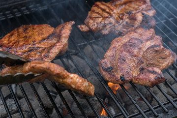 pork steak meat on bbq grill