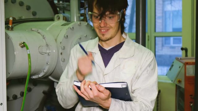 The emotional engineer fluttering his hair, waving his arms and writing down ideas in the production laboratory. The mad scientist gets ideas.