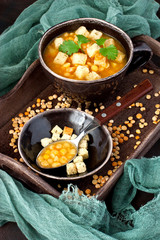 Yellow split pea soup with croutons and parsley