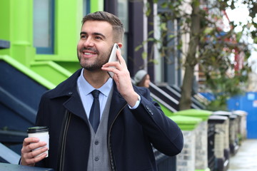 Stylish man calling by phone outdoors 