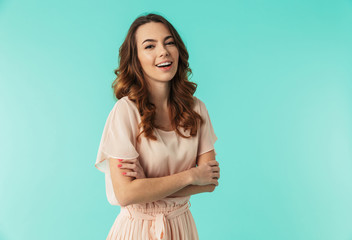 Obraz premium Portrait of a laughing young girl in dress