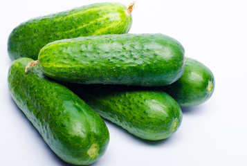 green cucumbers fresh on a white background