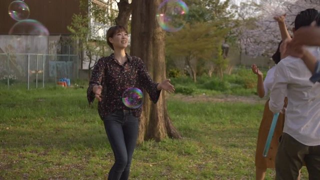 Bubble making in a park with international friends.