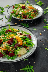 Fresh Beet, Orange salad with wild rocket, cheese and Pine nuts. healthy summer food