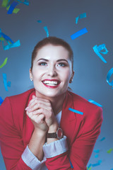 Obraz premium Portreit beautiful happy woman at celebration party with confetti .Birthday or New Year eve celebrating concept.