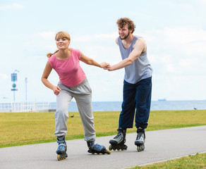 roller skater couple skating outdoor