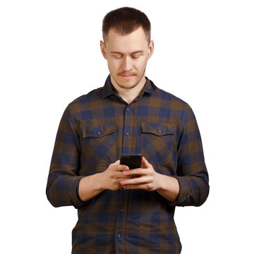 young man in a checkered shirt uses a mobile phone, casual clothes, isolated on white background