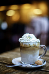 Ice Coffee Latte with Cream on blurry background