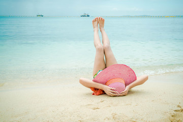 Lady sleep and relax on the beach