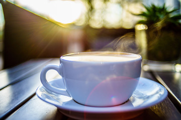 Caffe Latte with wooden background