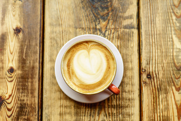 Caffe Latte with wooden background