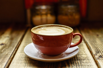 Caffe Latte with wooden background