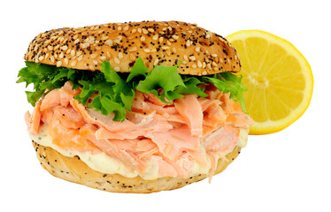 Salmon fish and cream cheese filled bagel sandwich isolated on a white background