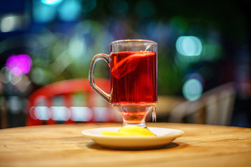 Red Fruit Tea with wooden background