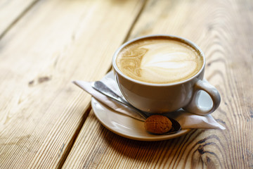 Caffe Latte with wooden background