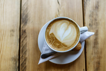 Caffe Latte with wooden background