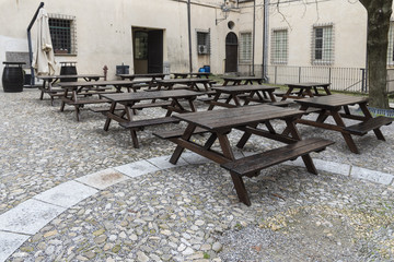 Series of wet empty wood tavern style tables