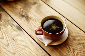 Americano Caffe with wooden background
