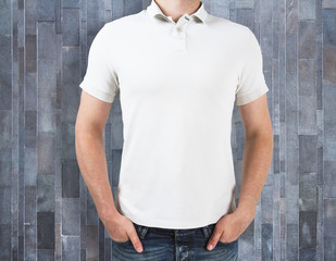 Man wearing empty shirt on wooden background