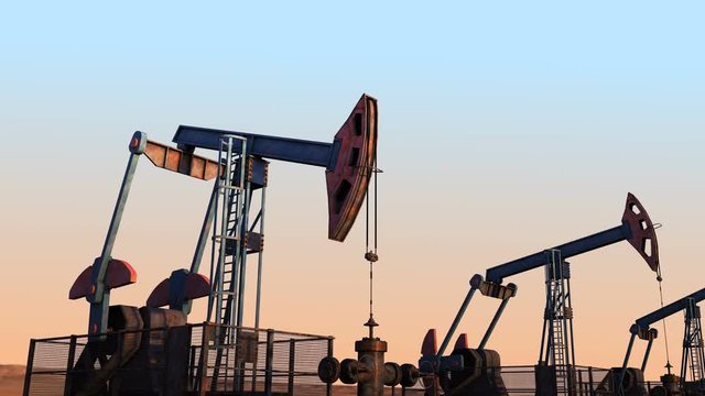 Looped move along oil pump jacks against clear sky width dunes on horizon