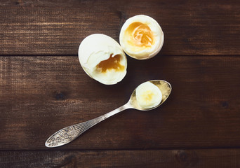 tasty boiled eggs over rustic background