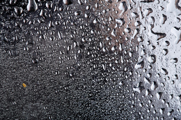 Colored water droplets on a gold background. Abstract liquid sprays