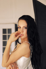 Fototapeta premium sexy beautiful woman with dark hair and evening makeup, in elegant clothes