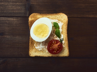 tasty boiled eggs over rustic background