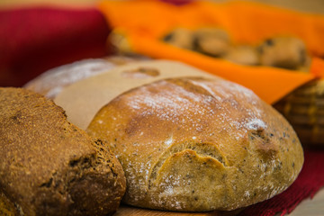 loaf of fresh bread on wooden surface.food closeup.