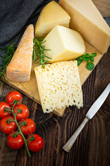 Cheeses with basil, rosemary and tomatoes.