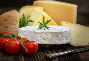 Cheeses with basil, rosemary and tomatoes.