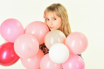 Little girl with hairstyle hold balloons. Beauty and fashion, punchy pastels. Kid with balloons at birthday. Small girl child with party balloons, celebration. Birthday, happiness, childhood, look.