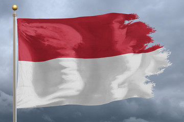 Fototapeta na wymiar Indonesia Flag with torn edges in front of a stormy sky