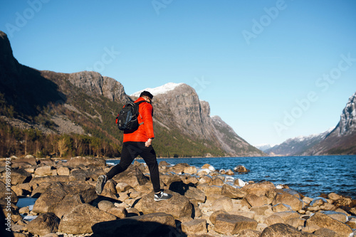 Man Jump On The Rocks Alone At Fjord In Norway Travel