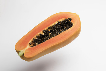 Inside of papaya on white background