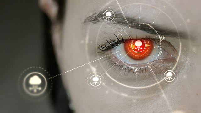 Young cyborg female blinks then cloud computing symbols appears.