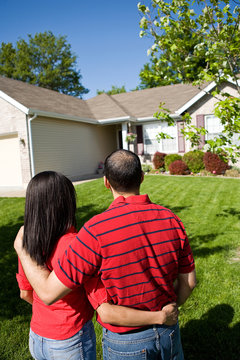 Home: Couple Looking at New Home
