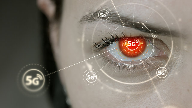 Young cyborg female blinks then high speed 5G symbols appears.