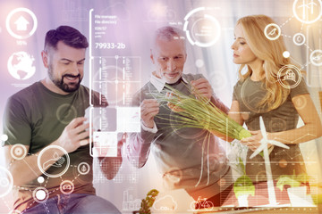 Landscape designers. Professional landscape designers feeling interested while being at work and discussing unusual plants