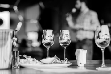 Wine tasting experience  with  glasses of wine on a table. Black and white background