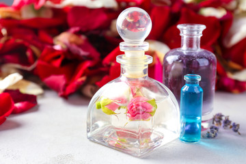 Bottles with perfume oil on table