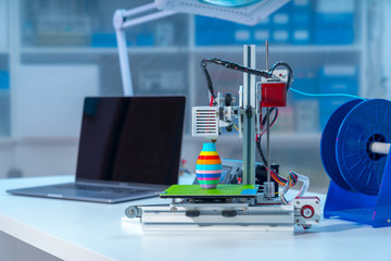 3D printer and computer on the table