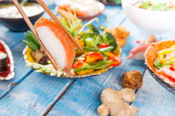 Various of asian meals on rustic background.