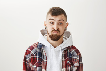 Holding breath, having no words to describe his surprise. Portrait of handsome funny caucasian guy...