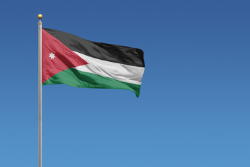 Fototapeta na wymiar Jordan Flag of in front of a clear blue sky