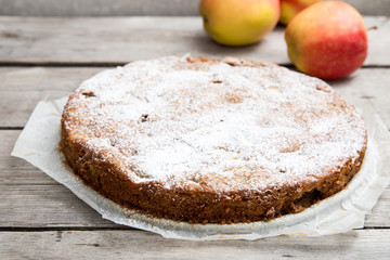 apple pie with whole-grain flour on a wooden background. concept of healthy eating