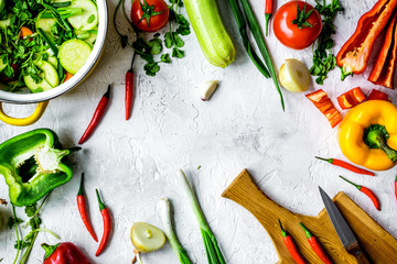 cooking vegetables on the stone background top view